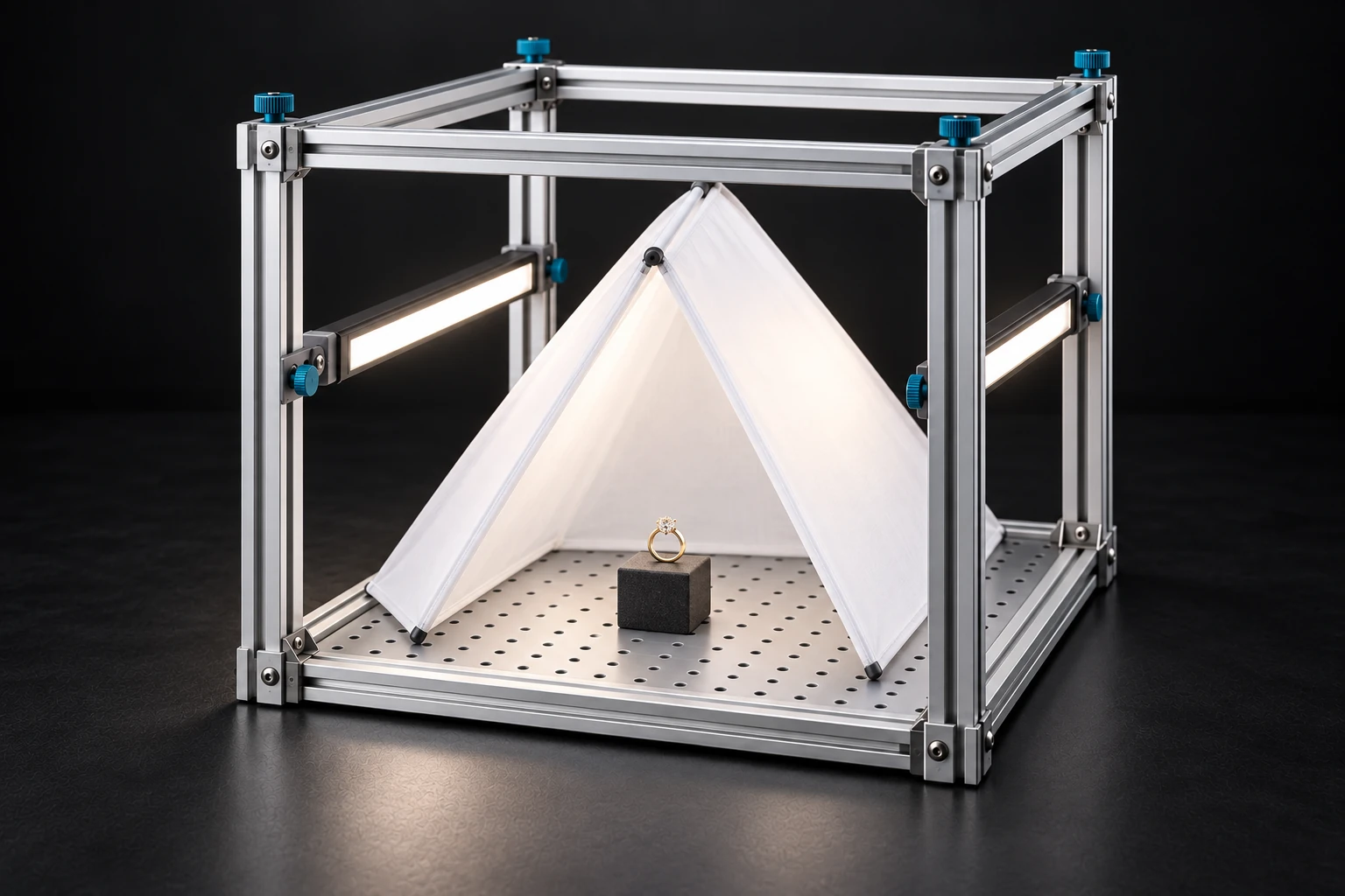 A ring inside a small triangular white diffusion tent, illuminated by LEDs outside the tent